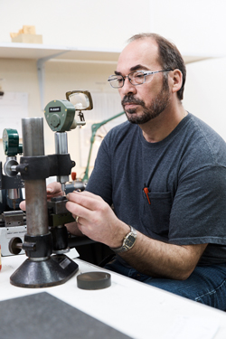 One of GLE's gage makers checks a product on a Mikrokator -- a highly accurate inspection device that measures down to .000002-inch increments.