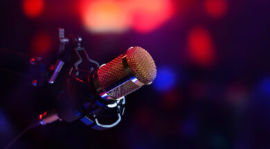studio microphone in neon lights. sound recording equipment