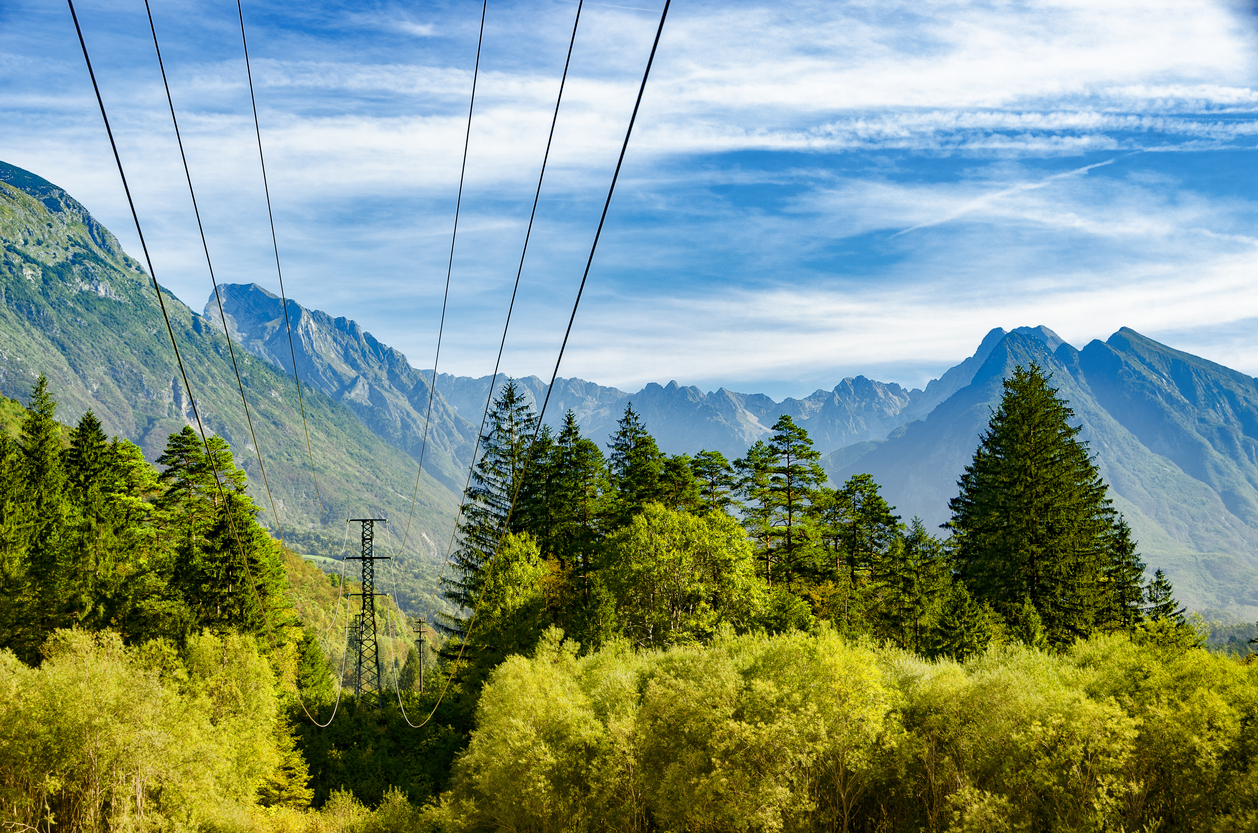 Power lines high in the mountains. Soca valley, Slovenia. Energy transmission in mountain regions