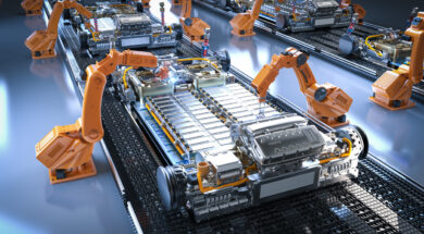 Robot assembly line with electric car battery cells module on platform