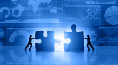 Business men teamwork joining puzzle on blue background