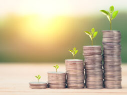 Business Finance and Money concept, Money coin stack growing graph with green nature background,investment concept