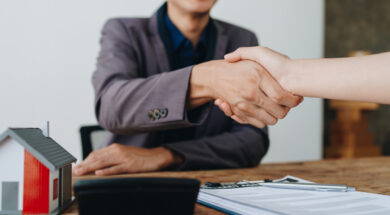 The bank’s Mortgage Officers shake hands with customers to congratulate them after signing a housing investment loan agreement