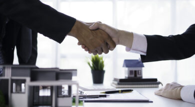 Agent and customer shake hands when successful trading houses. House and real estate trading ideas.