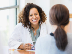 Caring doctor listens to patient