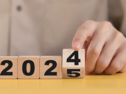 Business plan and countdown to 2025, The hand changing 2024 to 2025 on wooden cubes, Starting new business target strategy concept, Prepare to enter the new year.