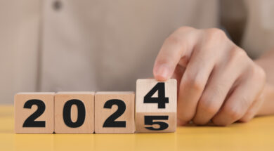 Business plan and countdown to 2025, The hand changing 2024 to 2025 on wooden cubes, Starting new business target strategy concept, Prepare to enter the new year.