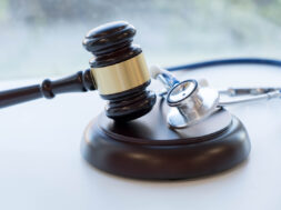 Gavel and stethoscope. medical jurisprudence. legal definition of medical malpractice. attorney. common errors doctors, nurses and hospitals make