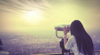 Girl looking with binoculars