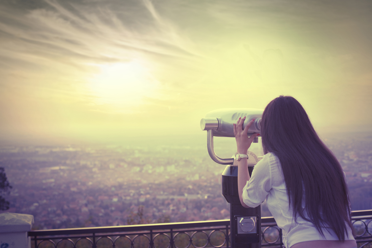 Girl looking with binoculars