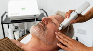 Man at the spa getting a facial laser treatment