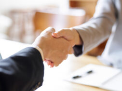 Business people shaking hands at a meeting