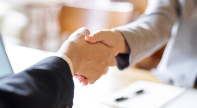 Business people shaking hands at a meeting