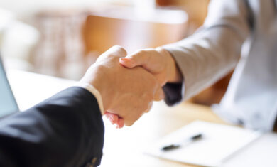 Business people shaking hands at a meeting