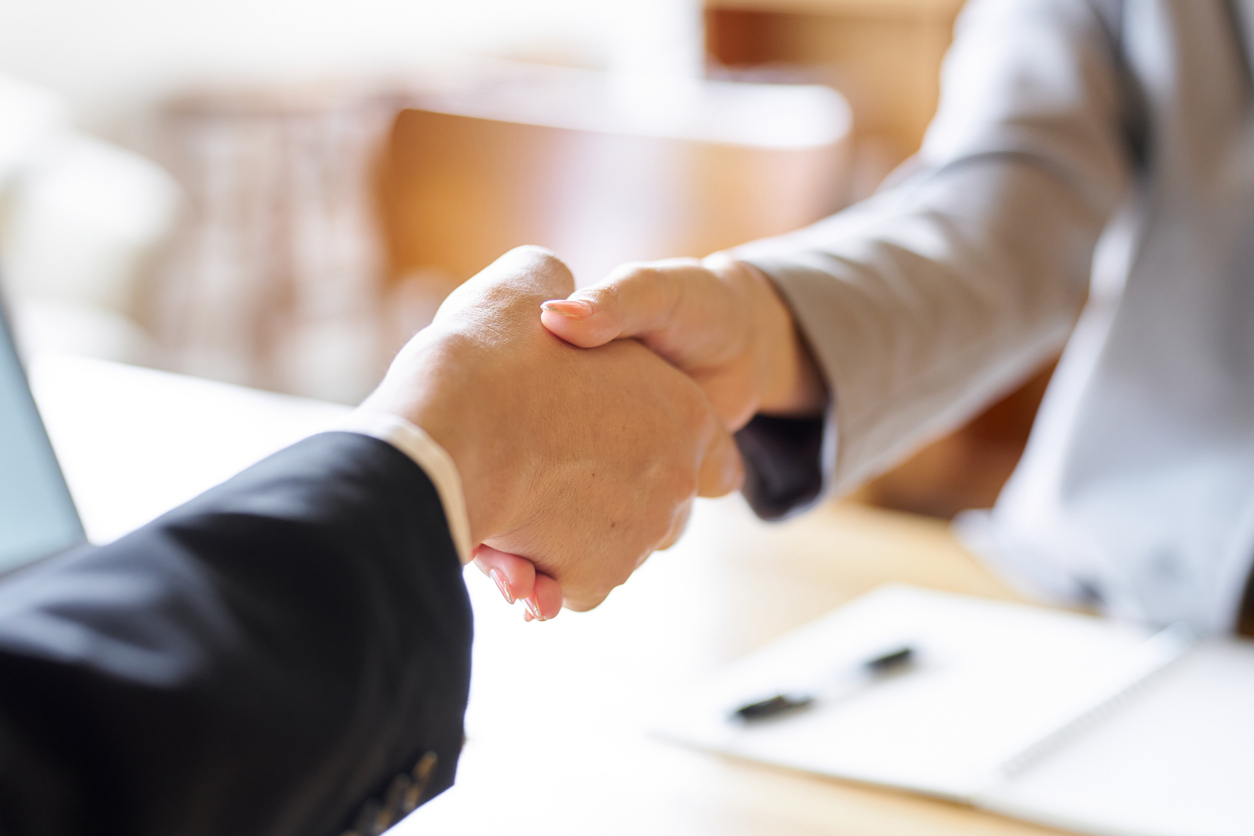 Business people shaking hands at a meeting