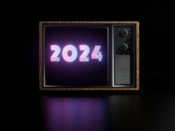 Retro Television Displaying Neon 2024 Text in a Dark Background