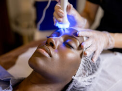 Woman at the spa getting an ultrasound treatment on her face