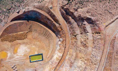 AERIAL VIEW OF OPEN PIT MINE WITH ENVIRONMENTAL REMEDIATION