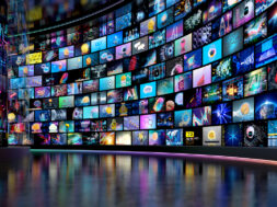 Media concept – multiple television screens. Digital data streaming concept.