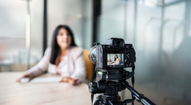 Businesswoman recording tutorial at office