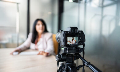 Businesswoman recording tutorial at office