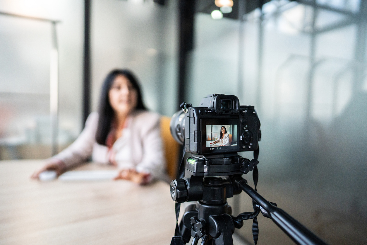 Businesswoman recording tutorial at office