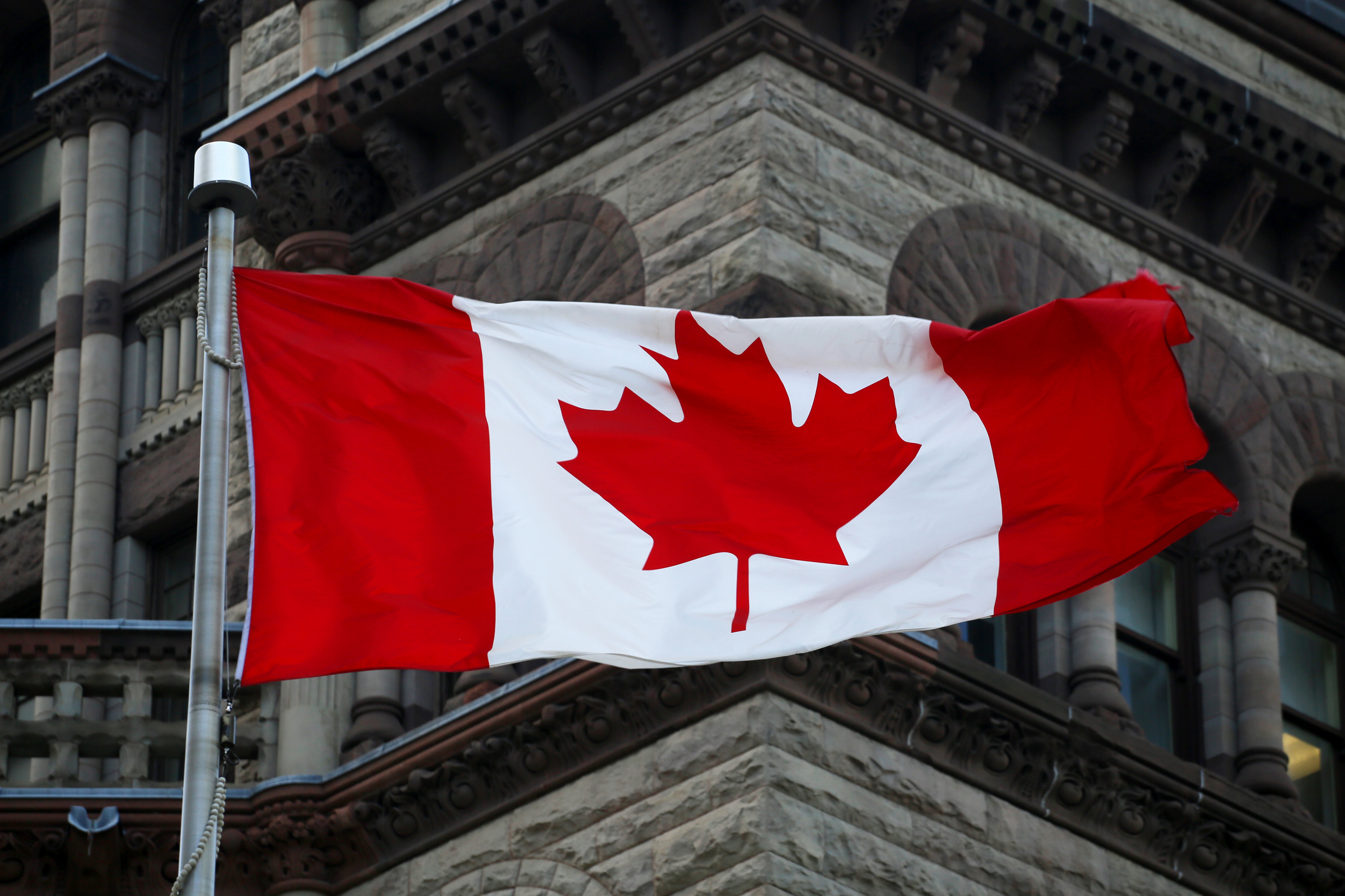 canada flag on parliament