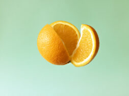 Slice of orange cut from orange