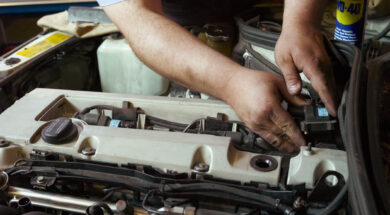 Mechanic working on car engine