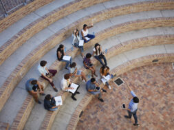 Students having class in outside auditorium