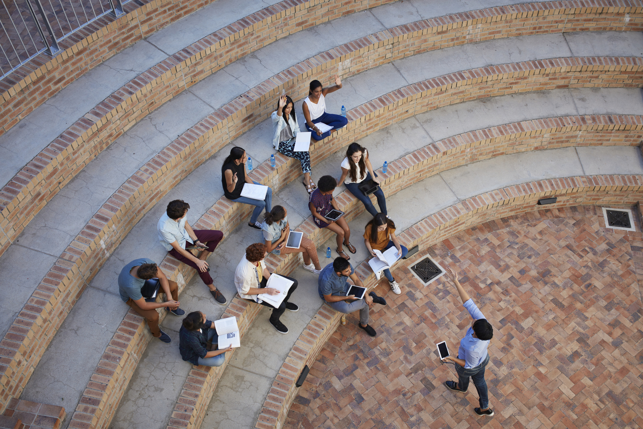 Students having class in outside auditorium