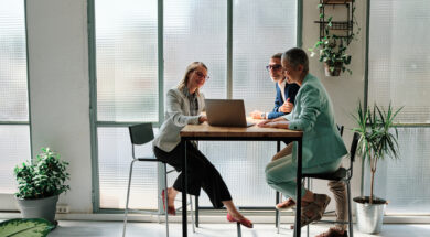 A financial advisor meeting with clients