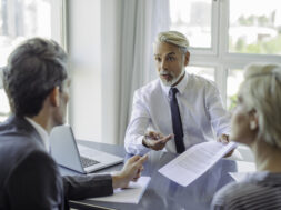 Business professionals negotiating
