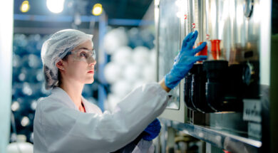 scientist worker checking the quality of Reverse osmosis machine system at the industrial factory. Female worker recording data at the control panel with measure pressure for recycle portable plant.