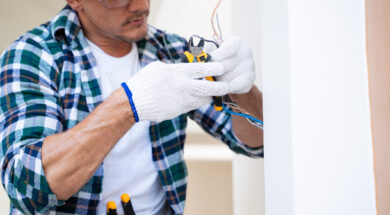 Electrician prepares the installation of electrical wiring.