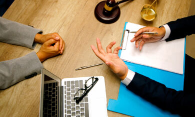 Business people and lawyers discussing contract papers sitting at the table. Concepts of law, legal services
