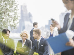 Business people talking outdoors