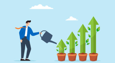 Businessman watering green plant shaped like grow up trend