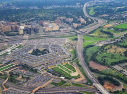 Aerial view of the United States Pentagon, the Department of Defense headquarters in Arlington, Virginia, near Washington DC, with I-395 freeway and the Air Force Memorial and Arlington Cemetery nearby.