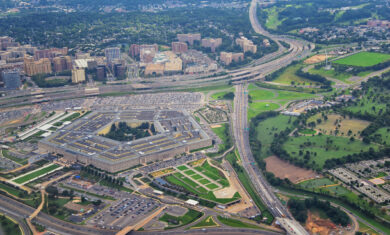 Aerial view of the United States Pentagon, the Department of Defense headquarters in Arlington, Virginia, near Washington DC, with I-395 freeway and the Air Force Memorial and Arlington Cemetery nearby.
