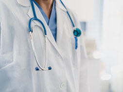 close-up of a doctor’s gown with stethoscope