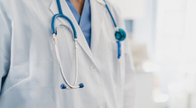close-up of a doctor’s gown with stethoscope