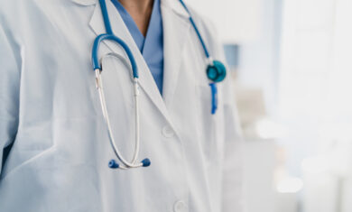 close-up of a doctor’s gown with stethoscope