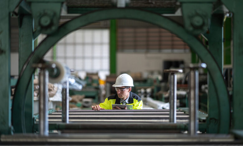 Male engineer and tablet working at manufacturing factory.