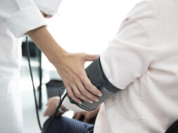 Measuring the pressure of senior woman