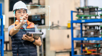 Japanese males engineer working on digital tablet and digitalization display in automated production line. He had development performance for use in automated machine. Production improvement concepts.