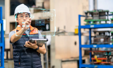 Japanese males engineer working on digital tablet and digitalization display in automated production line. He had development performance for use in automated machine. Production improvement concepts.