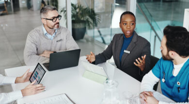 Doctors, nurses and discussion with tablet in clinic for medical results, health stats or feedback. Above, people or medicine team with screen for hospital budget, surgery planning or healthcare cost