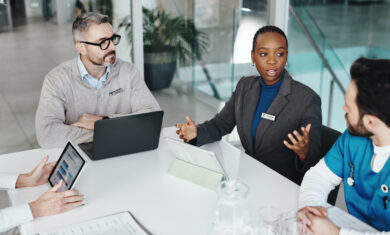Doctors, nurses and discussion with tablet in clinic for medical results, health stats or feedback. Above, people or medicine team with screen for hospital budget, surgery planning or healthcare cost