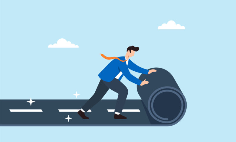 Flat illustration of businessman rolling out new road symbolizing career path development business planning direction and future opportunity